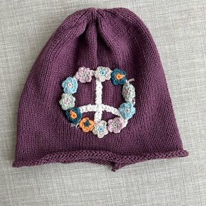 Purple knit beanie with flower peace sign